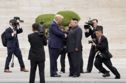 U.S. President Donald Trump meets with North Korean leader Kim Jong Un at the demilitarized zone separating the two Koreas, in Panmunjom, South Korea, June 30, 2019.