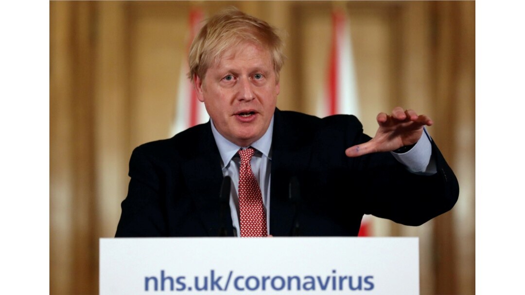 FILE - British Prime Minister Boris Johnson holds a news conference addressing the government's response to the coronavirus outbreak, at Downing Street in London, March 12, 2020.