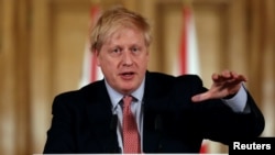British Prime Minister Boris Johnson holds a news conference addressing the government's response to the coronavirus outbreak, at Downing Street in London, March 12, 2020. 