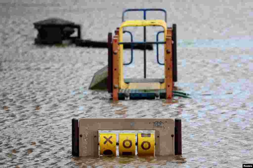 A playground is flooded after Storm Darragh hit the country, in Hereford, Britain.