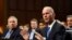 Boeing Company President and Chief Executive Officer Dennis Muilenburg, right, sitting next to Boeing Commercial Airplanes Vice President and Chief Engineer John Hamilton, left, testifies on Capitol Hill in Washington, Oct. 29, 2019.