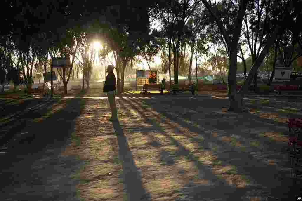 A man prays at the site of the Nova music festival, where hundreds of revelers were killed or kidnapped by Hamas, on the Jewish holiday of Simchat Torah, marking one year in the Hebrew calendar since the attack, near Kibbutz Re&#39;im, Israel.