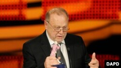 FILE - German director and cinematographer Josef Vilsmaier is awarded with the honorary award of the "Bavarian Film Prize" during the award ceremony in Munich, Germany, Jan. 15, 2010.