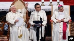 Pope Francis waves as he takes part in a meeting with members of the Catholic community at the Jakarta Cathedral in Jakarta, Indonesia, Sept. 4, 2024. (Yasuyoshi Chiba /Pool Photo via AP)