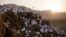 Muslim pilgrims pray on a rocky hill known as Mountain of Mercy, on the Plain of Arafat, during the annual hajj pilgrimage, ahead of sunrise near the holy city of Mecca, Saudi Arabia, Sept. 11, 2016.
