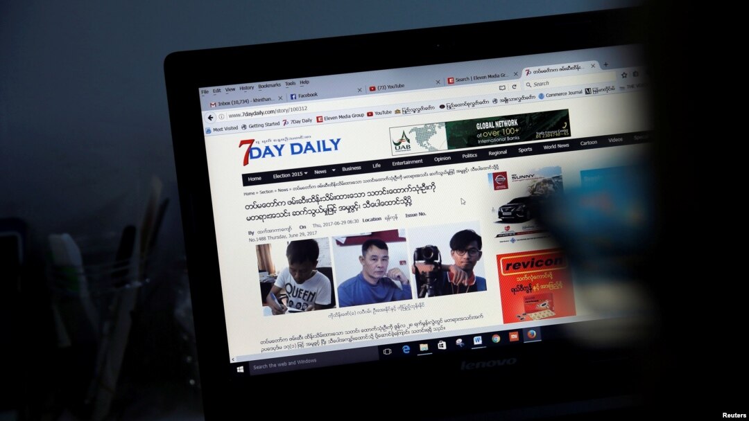 A reporter shows the news about journalists who were detained by Myanmar military, in the Democratic Voice of Burma (DVB) news room in Yangon, June 29, 2017. 