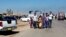 People leave their hometown Ramadi, 70 miles (115 kilometers) west of Baghdad, Iraq, April 15, 2015. 