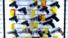 FILE - A selection of handguns are displayed at the Kittery Trading Post, Aug. 9, 2024, in Kittery, Maine. 