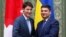 Canadian Prime Minister Justin Trudeau (L) and Ukraine's Prime Minister Volodymyr Groysman shake hands during a meeting in Kiev, Ukraine, July 11, 2016. 