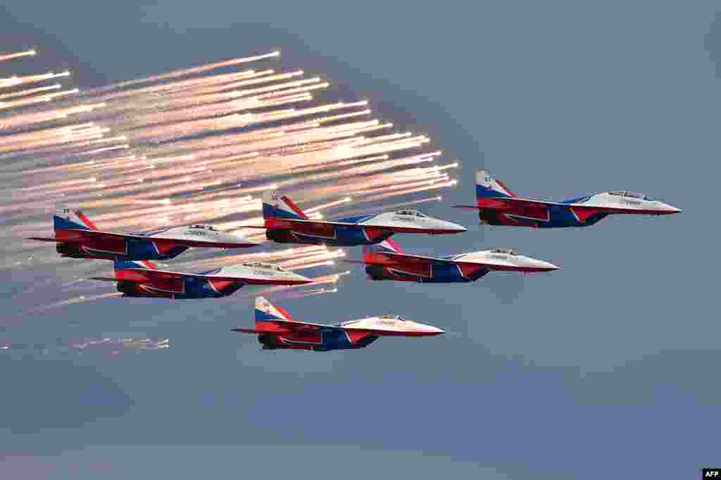 Russian aerobatic team Strizhi (Swifts) performs before the start of the Formula One Russian Grand Prix at the Sochi Autodrom circuit in Sochi.