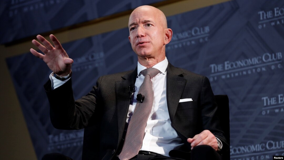 FILE - Jeff Bezos, president and CEO of Amazon and owner of The Washington Post, speaks at the Economic Club of Washington's "Milestone Celebration Dinner" in Washington, Sept. 13, 2018.