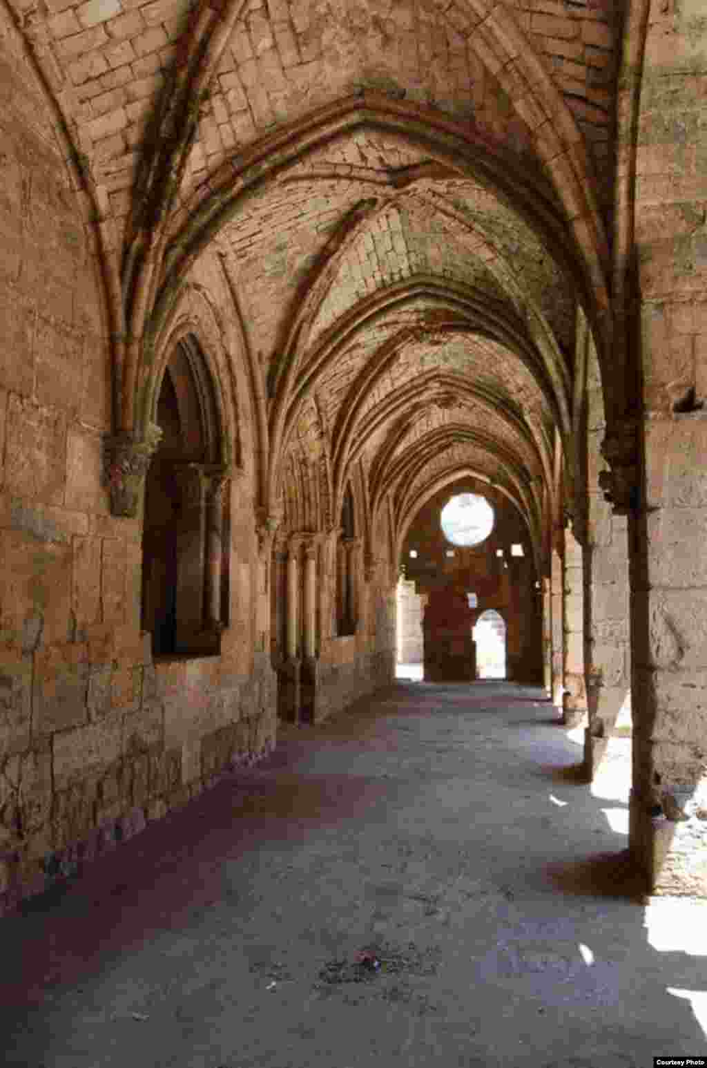 Arched interior of a corridor in the Crac des Chevaliers, a World Heritage site photographed by Christian Sahner before the Syrian conflict began.