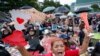 FILE - Pro-democracy activists shout slogans during a protest at Thammasat University in Bangkok, Thailand, Sept. 19, 2020. Demonstrators are calling for a new election and democratic reforms.