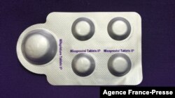 FILE - This image, courtesy of Plan C, shows a combination pack of mifepristone, left, and misoprostol tablets, two medicines used together to induce abortion, May 8, 2020.