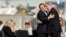 French President Francois Hollande (L) and Israeli Prime Minister Benjamin Netanyahu embrace during the official reception upon Hollande's arrival at Ben Gurion airport near Tel Aviv, Nov. 17, 2013.