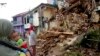 Residents inspect houses damaged by Monday's earthquake in Cianjur, West Java, Indonesia, Nov. 22, 2022. 