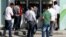 People line in front of automated teller machines in Hatay, May 17, 2013. 