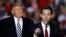 President Donald Trump listens as Republican Senate candidate Josh Hawley speaks during a campaign rally at Columbia Regional Airport, Nov. 1, 2018, in Columbia, Mo. 