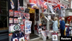 People browse for Royal Wedding souvenirs ahead of Prince Harry and Meghan Markle's wedding in Windsor, Britain, May 16, 2018. 