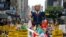 FILE - People march with an inflatable effigy of Republican presidential candidate Donald Trump during an immigrant rights May Day rally in Los Angeles, California, May 1, 2016. 