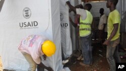 People construct a new Ebola treatment centre in Monrovia ,Liberia. Friday, Oct. 10, 2014.