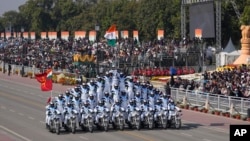 Indian Army's daredevils perform stunts through the ceremonial Kartavya Path during India's Republic Day parade celebrations in New Delhi, Jan. 26, 2025.