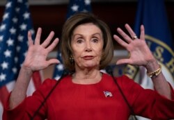 Speaker of the House, Democrat Nancy Pelosi, talks to reporters on the morning after the first public hearing in the impeachment probe of President Donald Trump, on Capitol Hill in Washington, Nov. 14, 2019.