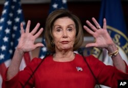 Speaker of the House, Democrat Nancy Pelosi, talks to reporters on the morning after the first public hearing in the impeachment probe of President Donald Trump, on Capitol Hill in Washington, Nov. 14, 2019.