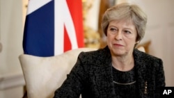 British Prime Minister Theresa May, seen in this July 24, 2018 file photo, has told the BBC in an interview scheduled for broadcast, Sept. 17, 2018, that she gets “irritated” by the debate over her leadership during Brexit negotiations.