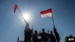 Indonesian activists gather in Surabaya to promote peace in Indonesia's Papua region, Sept. 2, 2019. 