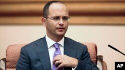 FILE - Albania's Foreign Minister Ditmir Bushati speaks during a meeting with China's State Councilor Yang Jiechi in Beijing, Aug. 26, 2016.