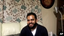 In this Nov. 21, 2017 photo, Irishman Ibrahim Halawa, who was recently acquitted after four years of imprisonment in Egypt, poses for a photograph at his home, in Dublin, Ireland. Halawa says he saw dozens of cellmates radicalize and adopt views of the so-called Islamic State during his brutal captivity in overcrowded jails.