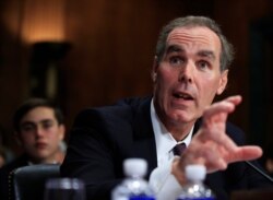 FILE - Eric Dreiband testifies before a Senate Judiciary Committee hearing on Capitol Hill in Washington, Sept. 6, 2017, regarding his nomination to be Assistant Attorney General, Civil Rights Division.