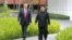 FILE - North Korea's leader Kim Jong Un, right, walks with U.S. President Donald Trump at the Capella Hotel on Sentosa island in Singapore, in this picture taken June 12, 2018, and released from North Korea's Korean Central News Agency. 