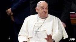 FILE - Pope Francis gestures after presiding over a Holy Mass at the Vatican on Feb. 11, 2024. Francis, who is suffering from a "slight flu," has canceled his appointments scheduled for Feb. 24, the Vatican announced in a press release.