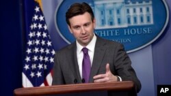 FILE - White House press secretary Josh Earnest.