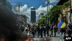 Demonstrators block a street during a protest against the government in Medellin, Colombia, June 28, 2021. 