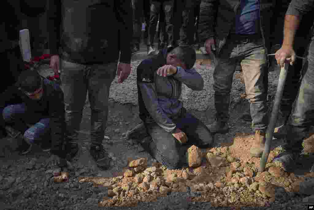 Mourners react next to the grave of 23-year-old hostage Hamzah AlZayadni during his funeral in the Bedouin city of Rahat, southern Israel. AlZayadni was in Hamas captivity in the Gaza Strip.