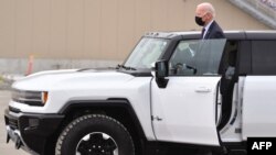 US President Joe Biden test drives a GMC Hummer EV