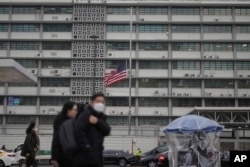 A U.S. flag flies at half-staff for the late former U.S. President Jimmy Carter at the U.S. Embassy in Seoul, South Korea, Dec. 30, 2024.