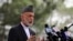 Afghanistan's former President Hamid Karzai speaks during a news conference in Kabul, Afghanistan, Tuesday, July 13, 2021. Former President Karzai calls on both the Afghan government and the Taliban to resume negotiations and end fighting in the country. (AP Photo/Rahmat Gul)