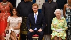 FILE PHOTO: Britain's Queen Elizabeth, Prince Harry and Meghan, the Duchess of Sussex, pose for a picture at in London, Britain June 26, 2018. John Stillwell/Pool via Reuters/File Photo