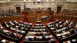 Greece's Prime Minister Alexis Tsipras addresses lawmakers on a controversial austerity bill during a parliamentary session in Athens, May 8, 2016.