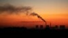 FILE - Steam comes from a coal-fired power station in Witbank, now called Emalahleni, South Africa, Oct. 11, 2021.