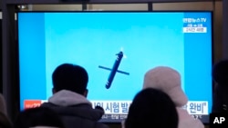 An image of North Korea's missile launch airs during a news program on a television at Seoul Railway Station in Seoul, South Korea, Jan. 26, 2025. 