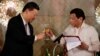 FILE - China's President Xi Jinping and Philippine President Rodrigo Duterte toast during a State Banquet at the Malacanang presidential palace in Manila, Philippines, Nov. 20, 2018.