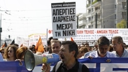 Protesters shout slogans during demonstration in Athens, Oct. 5, 2011
