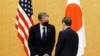 Japanese Prime Minister Yoshihide Suga, right, meets with U.S. Secretary of State Antony Blinken, left, during a courtesy call at the prime minister's official residence Tuesday, March 16, 2021. Defense and foreign ministers from the U.S. and Japan…