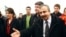 FILE - Pro-Kurdish politicians Sirri Sureyya Onder (R), Pelvin Buldan (L) and Altan Tan (C), are surrounded by media members before leaving for Imrali island in Istanbul, Feb. 23, 2013. 