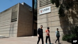 FILE - Students walk around the University of New South Wales campus in Sydney, Australia, Dec. 1, 2020.